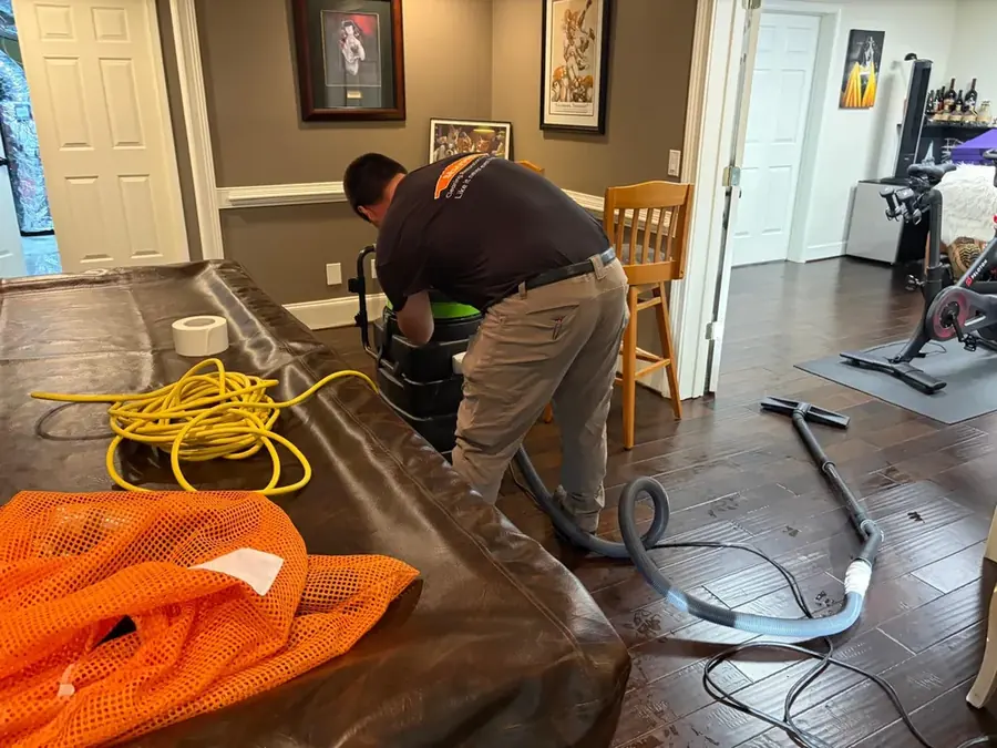 B&D Restoration technician extracting water from a Statham, GA home