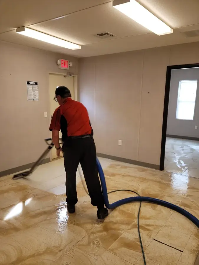 Technician checking a Statham floor with a moisture meter